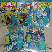 Five of the six X-Cutioner's Song comics shown together, each sealed in a clear protective bag with board, displaying vibrant cover artwork and attached Marvel trading cards.