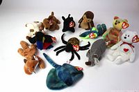 Full view of 12 vintage Ty Beanie Babies arranged on white background