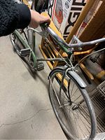 Photo showing the bicycle's handlebar with Kelly green frame and chrome parts.