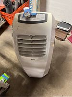 Front view of white LG portable air conditioner showing vents and overall condition