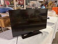 Front view of Samsung 32 inch flat screen TV showing the screen and base stand.