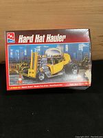 AMT Hard Hat Hauler model kit box showing unopened and detailed custom hot rod style vehicle with forklift front.