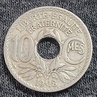 Obverse side of 1918 French 10 centimes coin showing denomination, year, and motto with center hole
