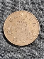 Close-up photo of the 1933 Canadian one cent coin showing the obverse side with the date, denomination, and maple leaf design.