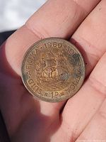Obverse side showing a historic sailing ship with inscriptions dated 1960 South Africa and denomination 1D