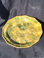 Top view of the octagonal platter showing mottled green and yellow glaze pattern.