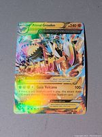 Front of the Primal Groudon EX foil Pokemon card showing character image, stats, attacks, and holographic finish