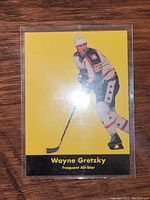 Front of Wayne Gretzky yellow Parkhurst hockey card with 'Frequent All-Star' text and player image in hockey gear.