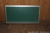 Front view of the vintage green chalkboard showing frame and chalk tray