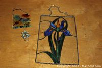 Image showing three stained glass decorations: large rectangular iris panel, small potted flower, square bird panel.