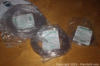 Three packs of clear plastic tubing sealed in plastic bags, labeled as Sister Labs nasal cannula tubing for adult use.