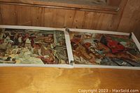 Two vintage Winchester advertising posters side by side showing men at dining and social gathering scenes