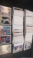 Stacks of 411 baseball cards from 1992 OPC collection laid out on a surface, showing front sides of several cards with player images.