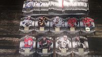 Hockey cards laid out showing players in action and embedded fabric swatch