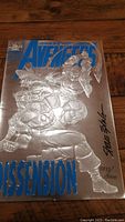 Front view of Avengers #363 comic book with foil embossed cover and visible autograph by Steve Epting along with numbering 4844/5000.