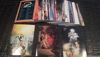 Stacked assortment of Boris II fantasy-themed trading cards showing colorful fantasy art including warriors and mystical figures, with backs visible of some cards.