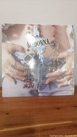 Front cover of Madonna Like a Prayer vinyl album showing Madonna's hands with jewelry and partial jeans.