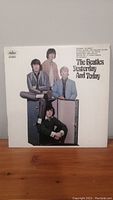 Front view of The Beatles Yesterday and Today vinyl record album cover featuring band members and album text.