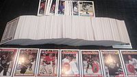 Wide view of the complete set of hockey cards spread out, showing the vast quantity and condition of the cards with key player cards displayed in front.