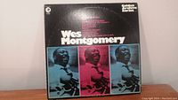 Front cover of Wes Montgomery vinyl album with title and portraits