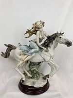 Front view of the “Liberty” porcelain figurine on wood base