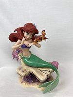 Front view of Ariel figurine seated on coral with seahorses