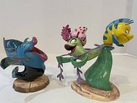 Front view of both figurines together on white background showing size and detail