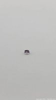 Full view of the 1.30 ct pastel pink spinel gemstone, cushion cut, showing a soft pink color and facets.