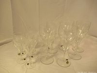 Full display of ten Villeroy & Boch crystal stemmed glasses of two sizes with etched patterns.