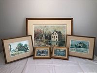 Group photo of five framed Keirstead prints showing various rural and mill scenes arranged together on a table.
