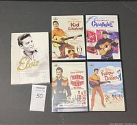 Top view of the DVD set showing the cover art for the 4 Elvis Presley movies and the white slipcase with Elvis photo and title.