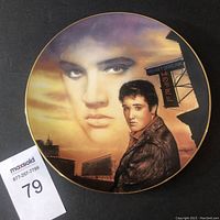 Front view of the round decorative plate showing detailed artwork of Elvis Presley with Heartbreak Hotel signage and full-color portrait.