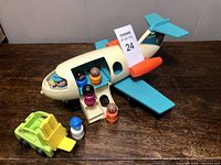 Front and side view of the Fisher Price airplane with Little People figures and forklift accessory