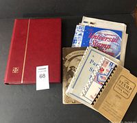Overview of all books and loose pages on black surface
