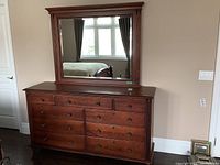 Front view of dresser topped by matching mirror, showing overall design and finish