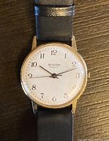 Close-up front view of the Sekonda watch showing white dial with black Arabic numerals and the 'Sekonda 17 Jewels' marking.