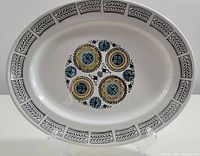 Front view of the oval ironstone platter showing full border and center pattern