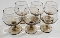 Group of 6 golden brown tinted vintage wine glasses, front view showing rounded bowl and stems