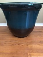 Front view of the large ceramic garden planter showing dark blue to brown gradient colors and wide shape