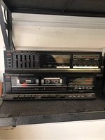 Fisher integrated stereo amplifier and double cassette deck unit on shelf