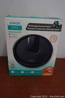 Front view of the Anker Eufy RoboVac 25C in its original box showing the product image and specifications.
