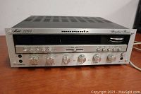 Front view of Marantz receiver showing faceplate, control knobs and tuning display.
