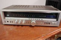 Front view of vintage Sansui 3900Z stereo receiver showing tuning dial and control knobs on silver faceplate.