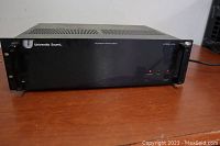 Front view of the University Sound A75 power amplifier showing brand, model and power amplifier labeling with rack ears.