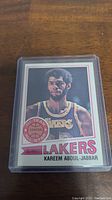 Front side of 1977-78 Topps Kareem Abdul-Jabbar basketball card showing player image, team, and name.
