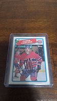 Front of Chris Chelios Montreal Canadiens hockey card with autograph in black marker.