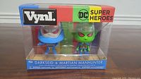 Front view of unopened Funko Vynl DC Super Heroes Darkseid and Martian Manhunter collectible figures in packaging showing the characters.