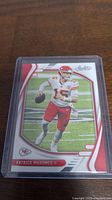 Front side of the Patrick Mahomes II 2021 Absolute Football trading card showing the player image and design.