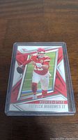 Front of a Patrick Mahomes II football card showing player in red Chiefs uniform with 'Rookies & Stars' label