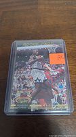 Front view of Shaquille O'Neal rookie basketball card in protective plastic sleeve showing player in Orlando Magic jersey with rookies badge and draft pick details.